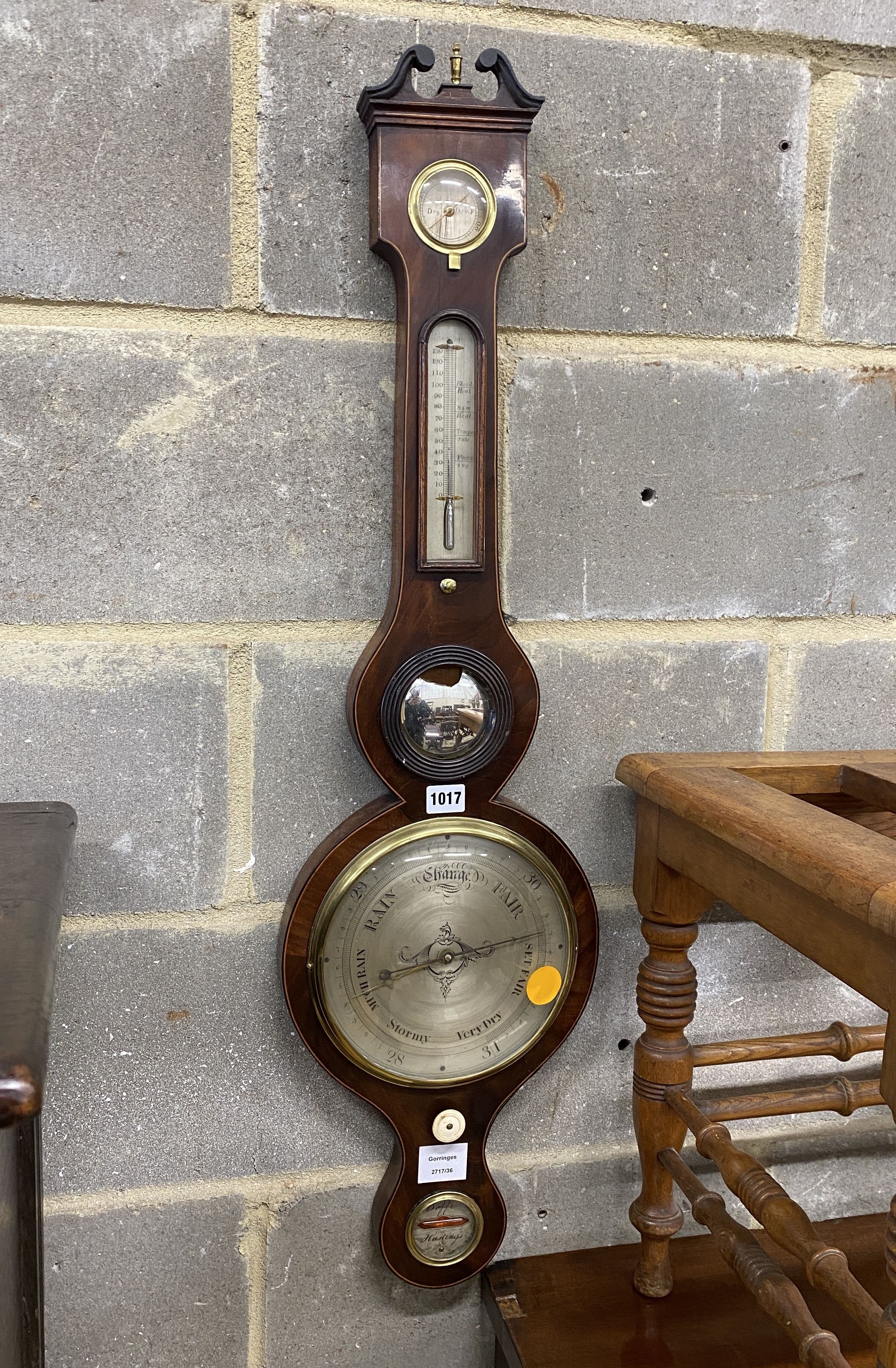 An early 19th century mahogany wheel barometer marked Beffi, Hastings, height 96cm